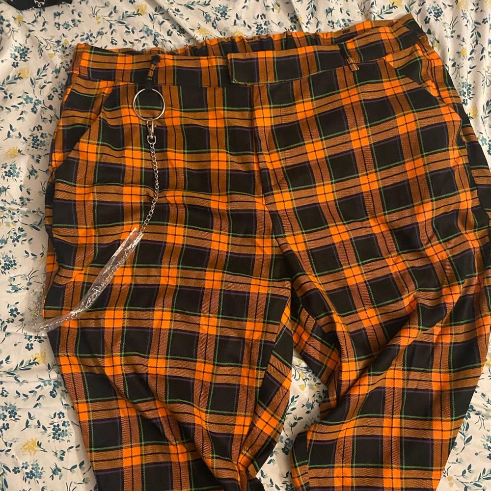 Orange and black plaid pants with chain
